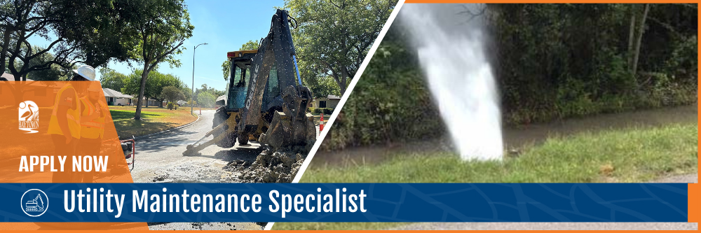Backhoe repairing damaged street